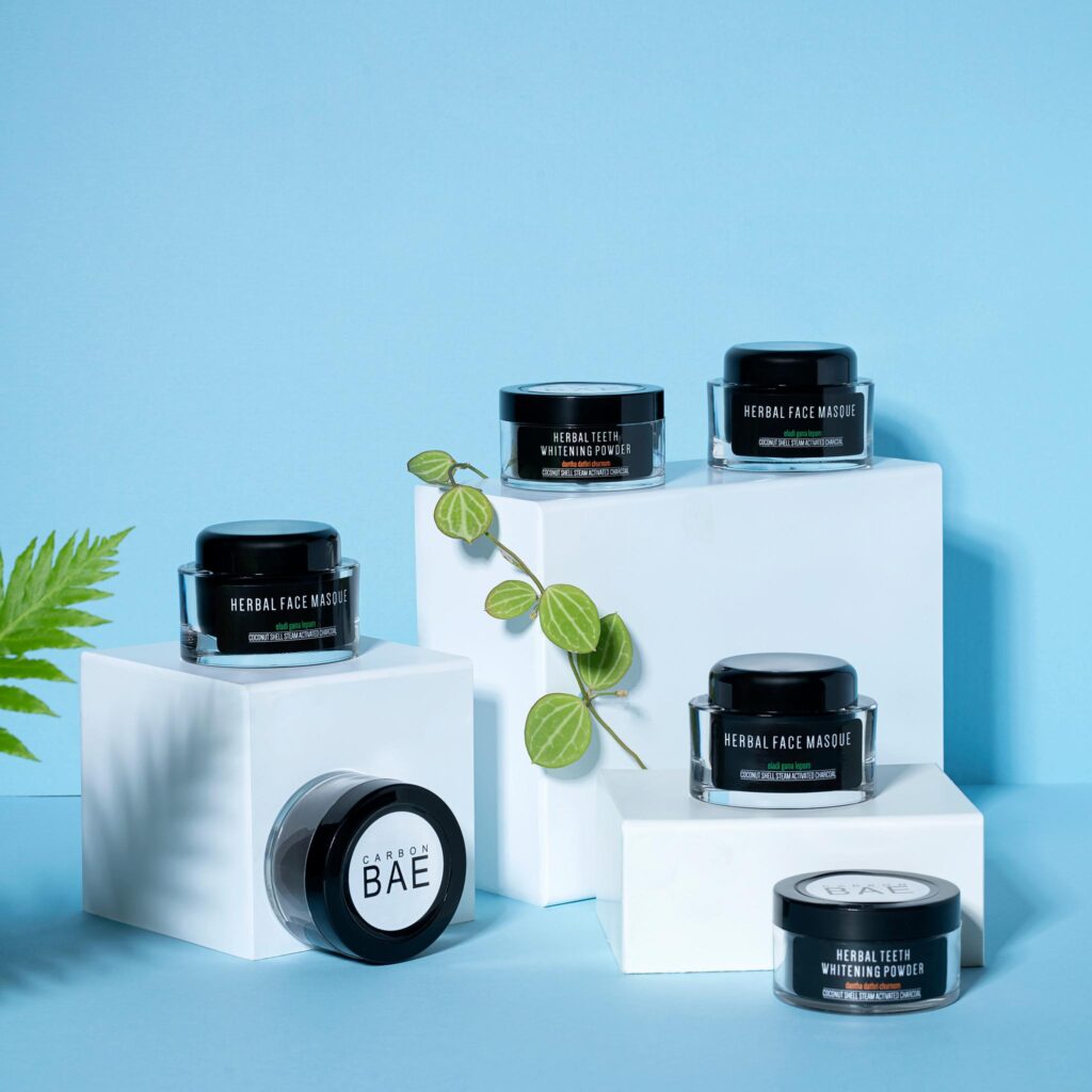 Clean and minimal skincare styling by a product photographer, showcasing Carbon Bae’s herbal masque and whitening powder.