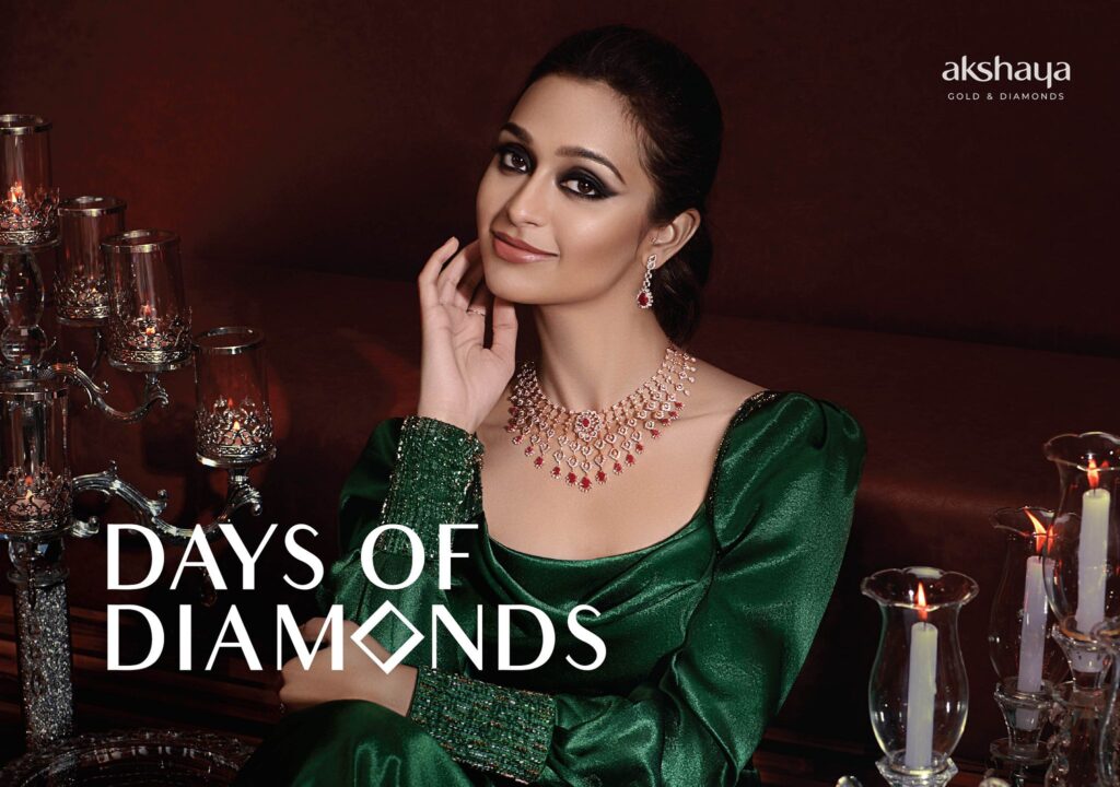 Akshaya Gold & Diamonds campaign featuring a woman in an emerald green dress adorned with ruby and diamond necklace and earrings, styled for the 'Days of Diamonds' collection