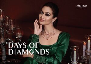 Akshaya Gold & Diamonds campaign featuring a woman in an emerald green dress adorned with ruby and diamond necklace and earrings, styled for the 'Days of Diamonds' collection