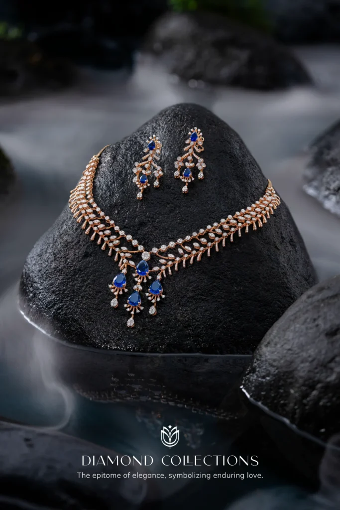 Tanmayi diamond and sapphire necklace on black stone with misty water