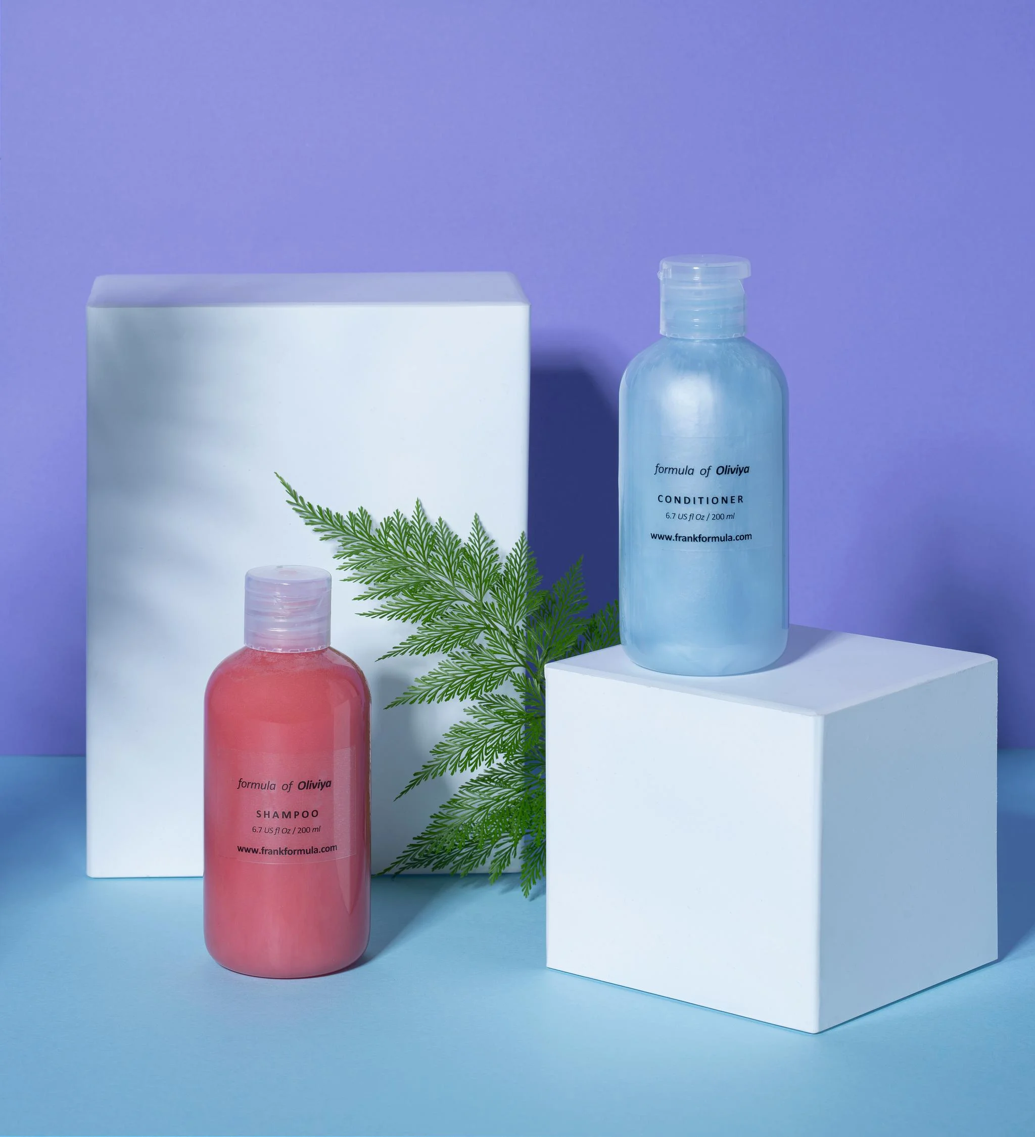 Formula of Oliviya shampoo and conditioner, styled with minimal elegance and a fresh, natural vibe.