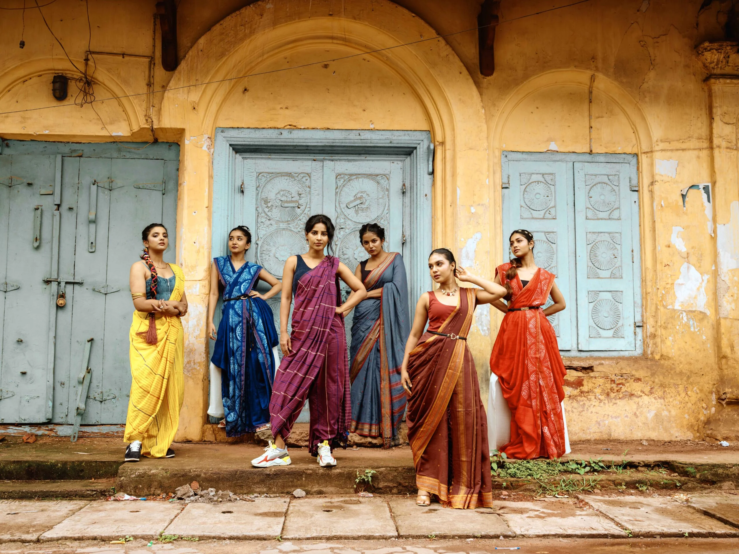 Group of women in colorful sarees.